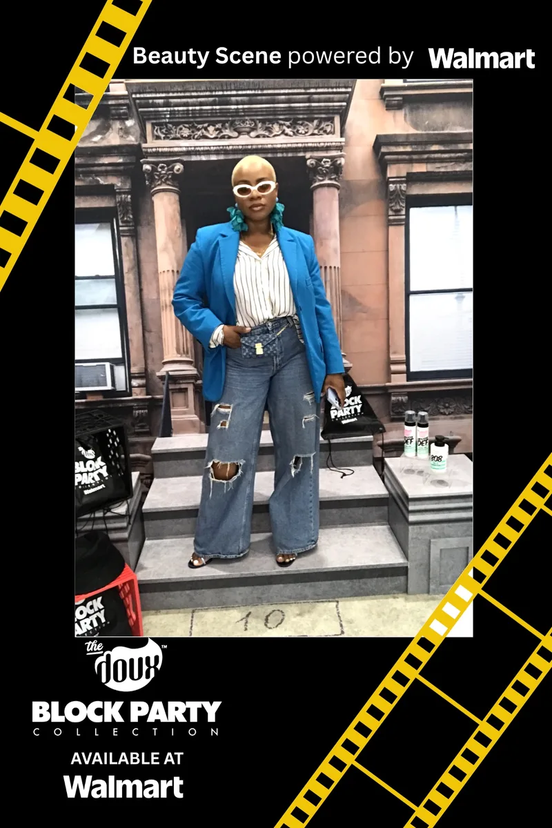 Guest in a blue blazer posing on the Block Party stoop set
