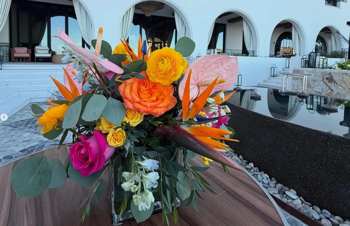 Colorful wedding floral centerpiece at a resort venue