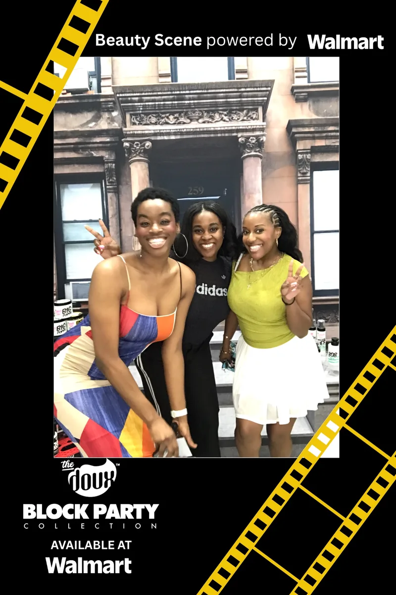 Three friends throwing peace signs at The Doux Beauty Scene photo booth