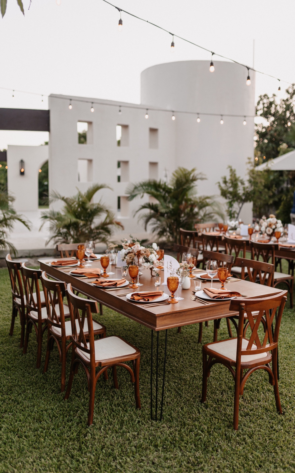 Emily and Lloyd's terracotta wedding reception tablescape at Baja Luna in Cabo