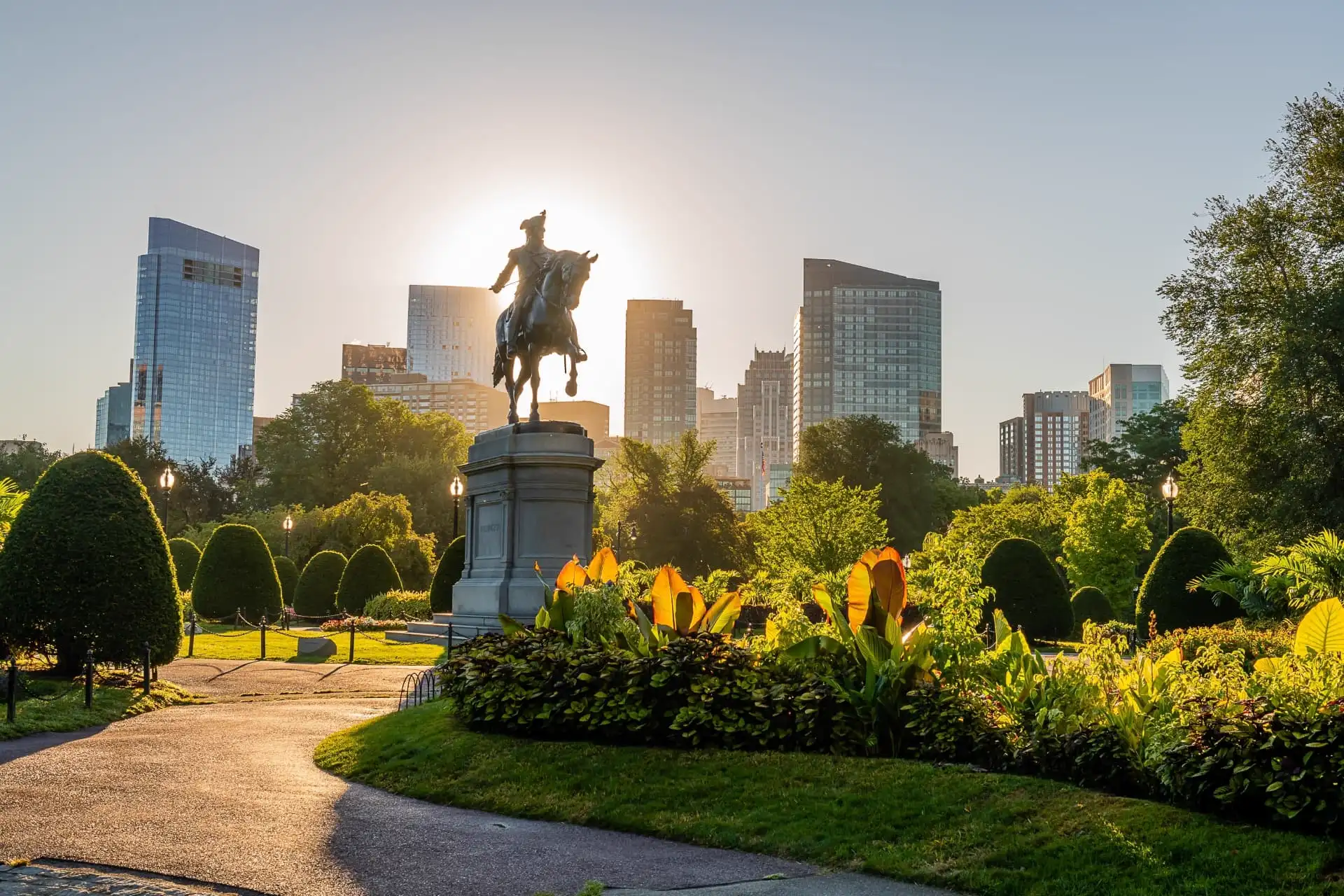 Boston skyline at sunrise seen from the Public Garden