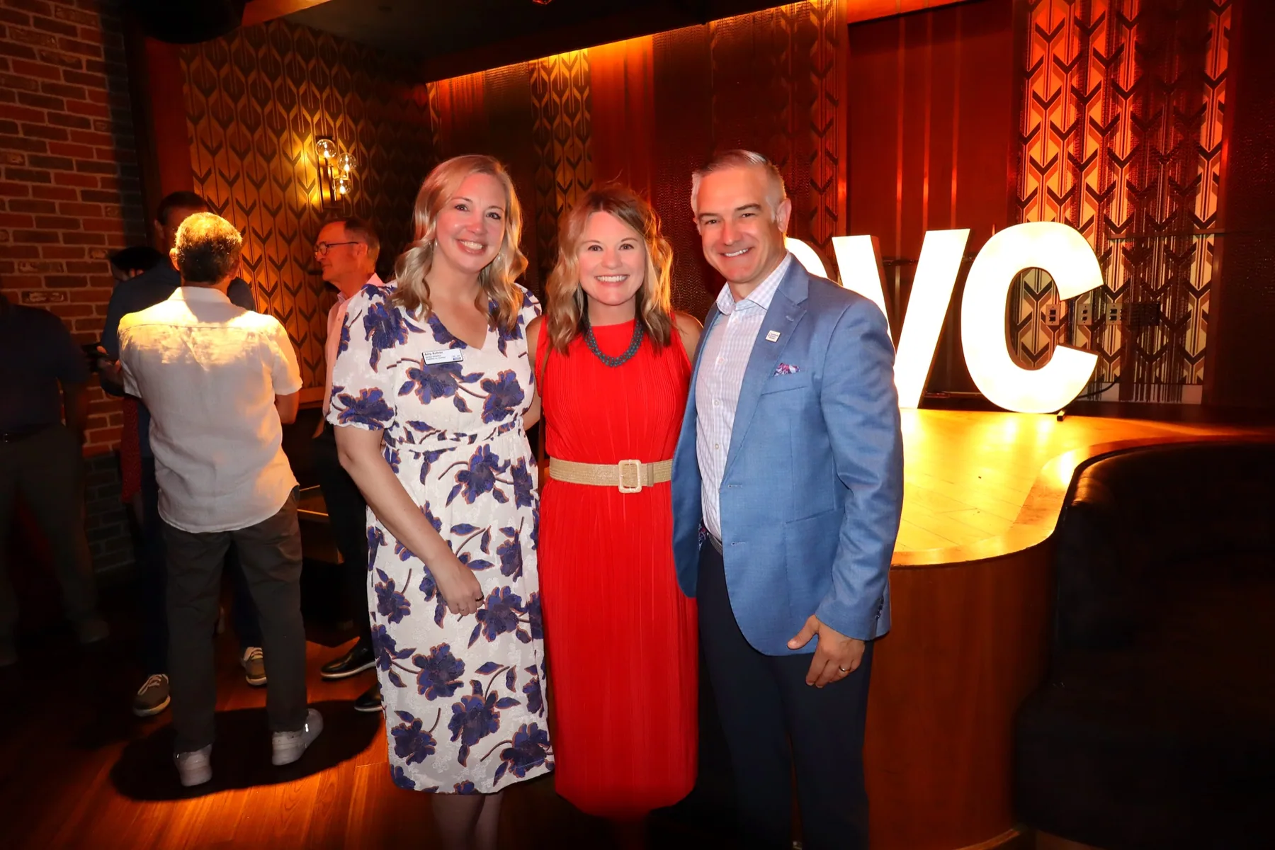 Guests posing at a branded tournament reception